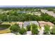 Aerial view of a neighborhood with a lake nearby at 10636 Dawns Light Dr, Riverview, FL 33578