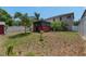 View of an outdoor cabana in the backyard with a covered patio with room for tools at 10636 Dawns Light Dr, Riverview, FL 33578