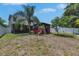 View of the backyard with grass and a shed at 10636 Dawns Light Dr, Riverview, FL 33578