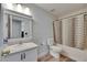 Bathroom featuring a vanity with a sink, a toilet, and a shower and tub combo with curtain at 10636 Dawns Light Dr, Riverview, FL 33578