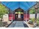 Outdoor cabana featuring a sheltered space with a corrugated steel roof and concrete access at 10636 Dawns Light Dr, Riverview, FL 33578