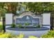 Elegant Brussels Bay community sign featuring stone accents and lush landscaping at 10636 Dawns Light Dr, Riverview, FL 33578