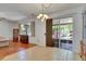 Sunlit dining area with sliding glass doors to the patio at 10636 Dawns Light Dr, Riverview, FL 33578