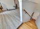 Upstairs hallway features wood stairs and floors and leads to the bedrooms and other living spaces at 10636 Dawns Light Dr, Riverview, FL 33578