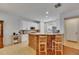 Kitchen with wood-finished bar and white cabinets offering a great space for entertaining at 10636 Dawns Light Dr, Riverview, FL 33578