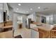 Bright kitchen featuring white cabinetry, stainless steel appliances, and a tile backsplash at 10636 Dawns Light Dr, Riverview, FL 33578