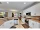 Functional kitchen with white cabinets, stainless steel appliances, and a view to the dining area at 10636 Dawns Light Dr, Riverview, FL 33578