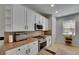 Well-lit kitchen featuring sleek countertops, stainless steel appliances, and ample cabinet space at 10636 Dawns Light Dr, Riverview, FL 33578