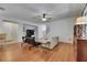 Living room featuring wood floors, staircase, and open layout at 10636 Dawns Light Dr, Riverview, FL 33578