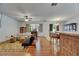 Living room featuring a ceiling fan, ample seating, and sliding doors leading to the dining area at 10636 Dawns Light Dr, Riverview, FL 33578