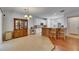 Open-concept living space connecting the kitchen and dining areas with hardwood floors at 10636 Dawns Light Dr, Riverview, FL 33578