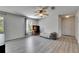 Loft space with wood-look floors and a desk area with natural light from the windows at 10636 Dawns Light Dr, Riverview, FL 33578