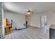Open loft space features wood-look floors, desk area, and provides access to additional rooms at 10636 Dawns Light Dr, Riverview, FL 33578