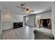 Spacious loft with wood-look floors, a ceiling fan, and a desk area with lots of natural light at 10636 Dawns Light Dr, Riverview, FL 33578