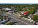 Aerial view of property with a road out front, pointing with a red arrow at 10701 Village Green Ave, Seminole, FL 33772