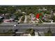 Aerial view of property with a road out front, pointing with a red arrow at 10701 Village Green Ave, Seminole, FL 33772