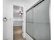 Bathroom showcasing tiled floors and a glass door shower at 10701 Village Green Ave, Seminole, FL 33772
