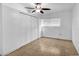 This bedroom has tile flooring, a closet, and is well-lit at 10701 Village Green Ave, Seminole, FL 33772