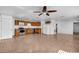 Spacious kitchen with stainless steel appliances, wood cabinetry, and tile flooring at 10701 Village Green Ave, Seminole, FL 33772