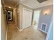 Hallway features tile flooring, multiple doors, and a full length mirror at 1101 Alcazar S Way, St Petersburg, FL 33705