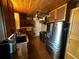 Kitchen with stainless steel refrigerator, wooden cabinets, granite countertops, stainless steel stove, and unique wood plank ceiling at 1101 Alcazar S Way, St Petersburg, FL 33705