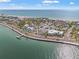 Overhead view of a coastal neighborhood with beach access, showing the clear blue water and white sandy beaches at 1104 Pass A Grille Way, St Pete Beach, FL 33706