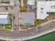An aerial view shows this single-Gathering home with a gray roof and a well-maintained yard in a coastal location at 1104 Pass A Grille Way, St Pete Beach, FL 33706