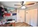 Bedroom features a ceiling fan, wood floor, a closet, and natural light from the window at 11314 Silverleaf Ct, Riverview, FL 33579