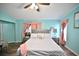 Charming bedroom featuring plush bedding, ambient lighting, and a ceiling fan at 11314 Silverleaf Ct, Riverview, FL 33579