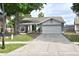 Charming single-story home with well-manicured lawn and mature trees, offering great curb appeal at 11314 Silverleaf Ct, Riverview, FL 33579