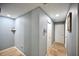 Hallway with tile flooring, neutral paint and doors to bedrooms or bathrooms at 11314 Silverleaf Ct, Riverview, FL 33579