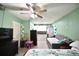 Open living area featuring wood floors and connection to a compact kitchen at 11314 Silverleaf Ct, Riverview, FL 33579