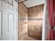 Bathroom shower stall features tile surround with decorative accent and a shower head at 11314 Silverleaf Ct, Riverview, FL 33579