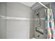 Updated shower with tiled walls, mosaic accents, and recessed shower caddy at 11314 Silverleaf Ct, Riverview, FL 33579