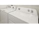 Close-up of Whirlpool washer and dryer appliances in a laundry room at 11359 Boundless Ter, Venice, FL 34293