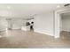 Bright living room with tile flooring, leading to the kitchen and entryway, with ample natural light at 11359 Boundless Ter, Venice, FL 34293