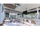 Contemporary bar area with high-top seating, modern finishes, and panoramic views of the surrounding scenery at 11375 Boundless Ter, Venice, FL 34293