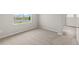 Cozy bedroom featuring carpeted floors and a window overlooking the neighborhood at 11375 Boundless Ter, Venice, FL 34293