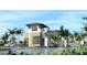Beautifully designed guardhouse at the community entrance with lush landscaping and water feature at 11375 Boundless Ter, Venice, FL 34293