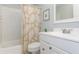 Well-lit bathroom featuring a bathtub, toilet, and sink at 11404 2Nd N St # 3, St Petersburg, FL 33701