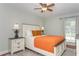 Comfortable bedroom with two side tables, warm lighting, and a large bed at 11404 2Nd N St # 3, St Petersburg, FL 33701
