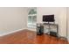 Bright room featuring a modern desk and large window at 11404 2Nd N St # 3, St Petersburg, FL 33701