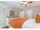 Bright bedroom featuring neutral walls, wood floors, and a white dresser at 11404 2Nd N St # 3, St Petersburg, FL 33701