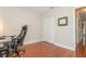Bedroom area with hard wood floors, a closet, and a gaming chair at 11404 2Nd N St # 3, St Petersburg, FL 33701