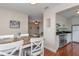 The dining area with a view sits adjacent to the kitchen and a cozy living room space at 11404 2Nd N St # 3, St Petersburg, FL 33701