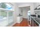 The sun-drenched dining area features a large arched window that floods the space with natural light at 11404 2Nd N St # 3, St Petersburg, FL 33701