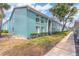 Exterior of the building featuring a lovely, blue facade and well-kept greenery at 11404 2Nd N St # 3, St Petersburg, FL 33701