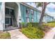Charming two-story home with well-maintained landscaping and stairs to the front door at 11404 2Nd N St # 3, St Petersburg, FL 33701
