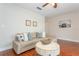 Living room featuring hardwood floors, a comfortable sofa, and decorative art at 11404 2Nd N St # 3, St Petersburg, FL 33701