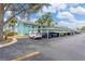 Well-maintained parking lot adjacent to a beautiful building and nice trees at 11404 2Nd N St # 3, St Petersburg, FL 33701